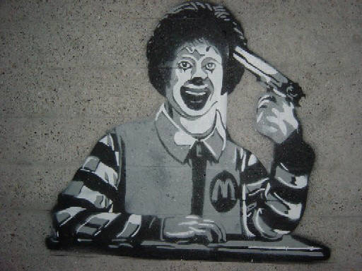 Ronald McDonald schiesst sich die Scheisse aus dem Hirn. GEM Schablonen Graffiti in Zürich Schweiz. Ronald McDonald shoots himself, blows his brains out. 3 layer stencil graffiti in Zurich Switzerland